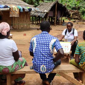 female facilitator raising awareness