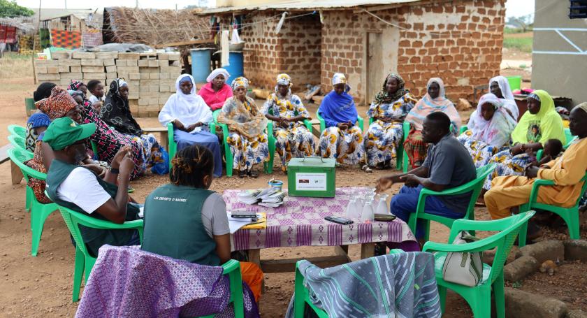 Group of women sitting in circle during a VSLA meeting