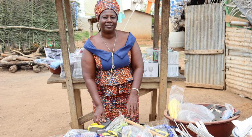 Woman posing next to her stall