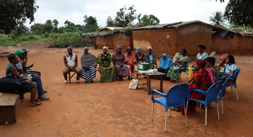 Group of women sitting in circle during a VSLA meeting