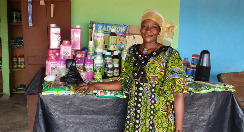 Woman posing next to her stall