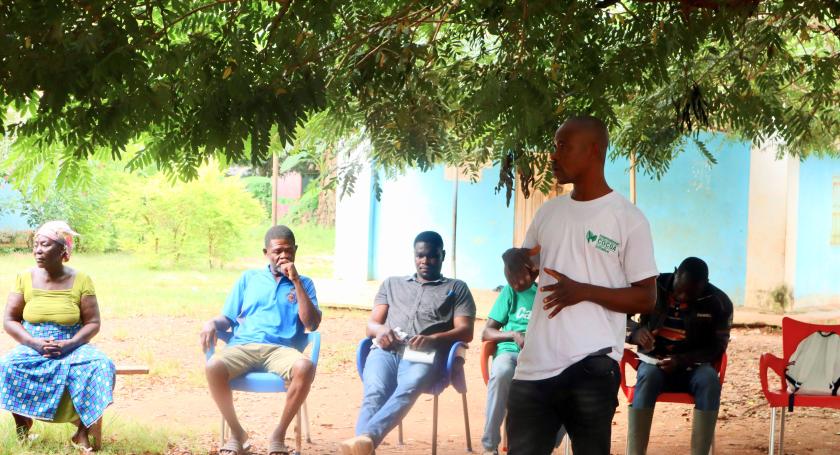 man speaks in workshop