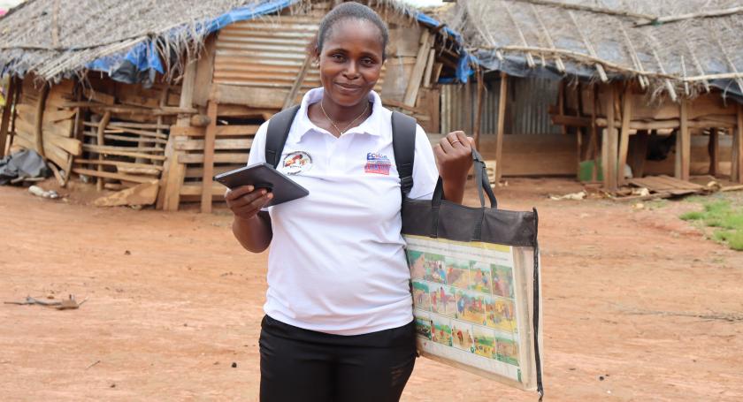 community facilitator poses with her tools