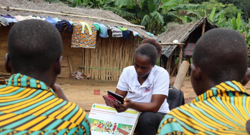 community facilitator inputting data into tablet